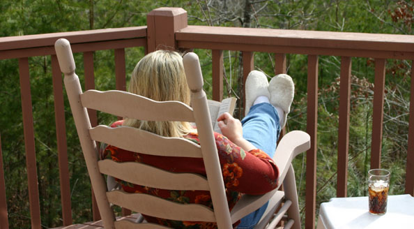 Lady sitting on the deck.